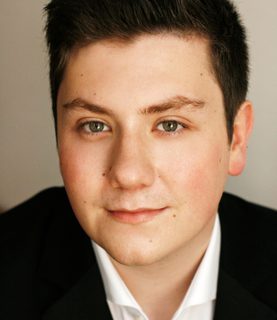 A close-up of Kieran Carrel looking directly into the camera.