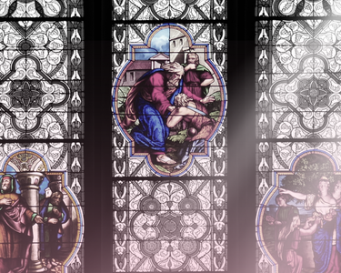 A ray of sun shines over stained glass.