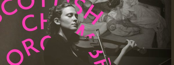 Lorenza plays her violin in front of a painting. Her eyes closed.