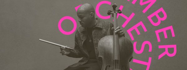 Sheku holds the cello in one hand and an outstretched bow in the other while facing to the right.