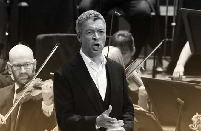 Roderick Williams sings at the Proms with the Orchestra playing behind.