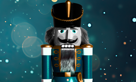A blue nutcracker soldier is featured with a blue glistening backdrop.