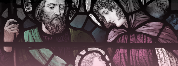 Stained glass window depicting Virgin Mary, Joseph and the infant son