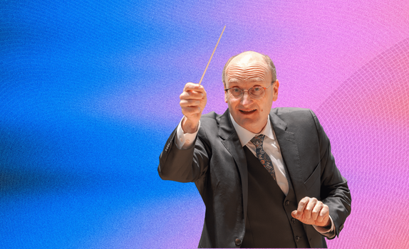 Andrew Manze conducting with the baton raised, against a gradient background of blue, pink, and orange waves.