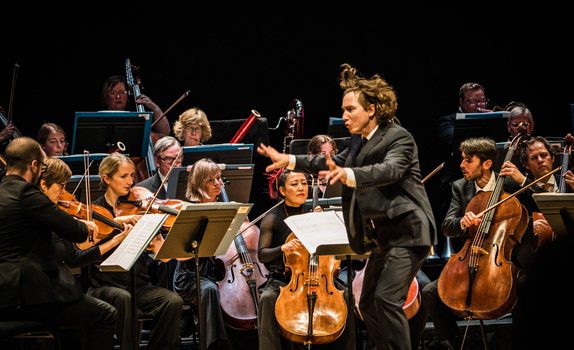 Maxim conducts wildly