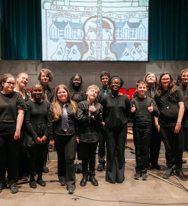 Castlebrae voices pose for a pciture and smile.
