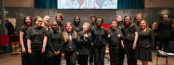 Castlebrae voices pose for a pciture and smile.