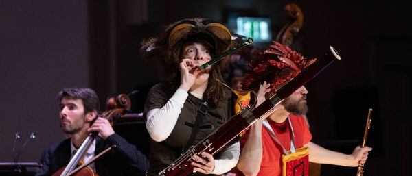 Cerys holds her bassoon in character as the Gaboon.