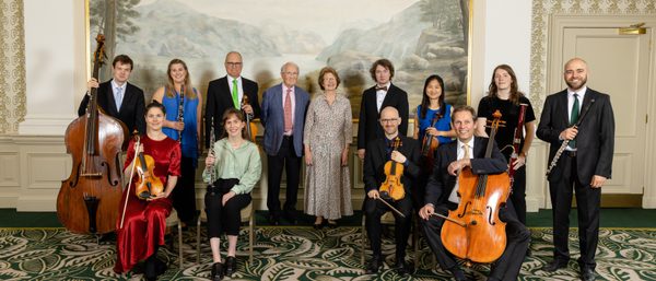 SCO musicians stand with SCO Life President Donald MacDonald and Louise MacDonald for a photo.
